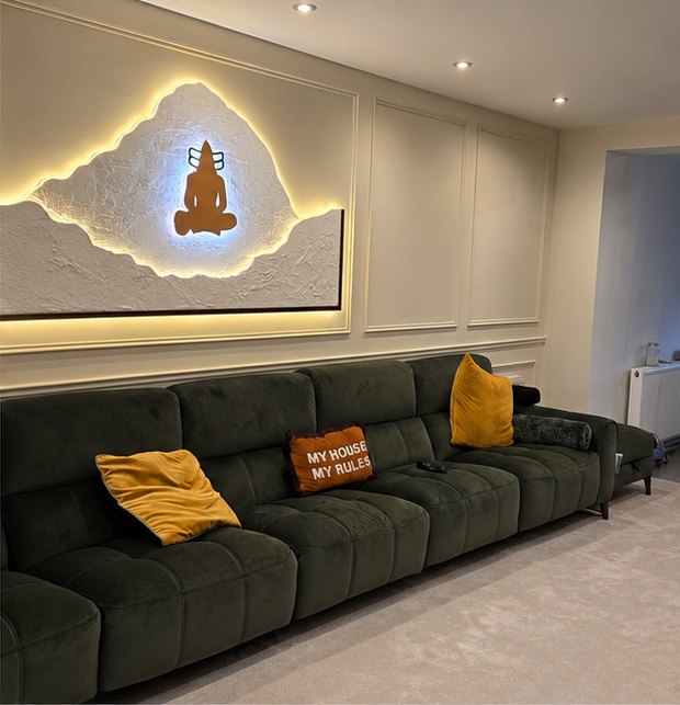 Panelled living room in warm off-white with a backlit feature panel, decorated in Leicester