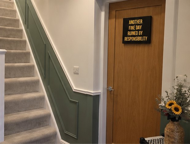 Green panelled staircase with oak door, Leicester