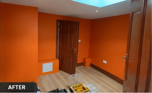 Bold orange room with dark panelled door, Leicester