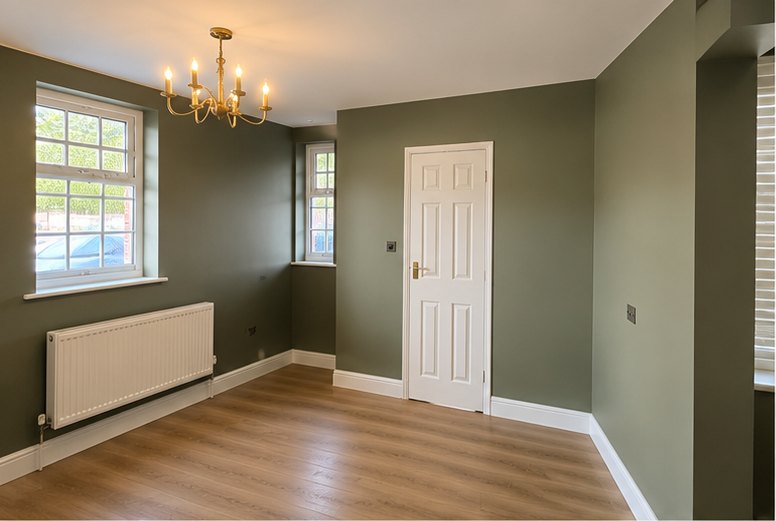 Sage green dining room with white woodwork and oak floor, Leicester